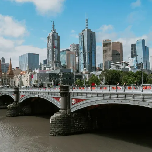 Bridge across the Yarra with the Melbourne skyline behind it